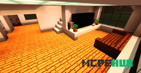 Гостиная с огромным телевизором и большим окном