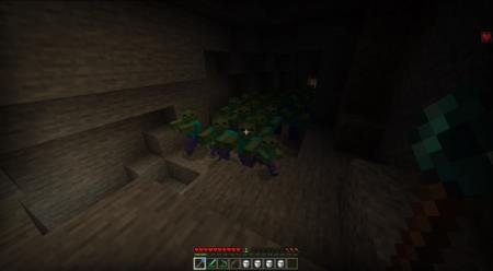 Игрок перед кучей зомби в пещере