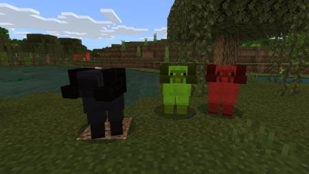 Рогатые овцы, покрашенные в чёрный, зелёный и красный цвет