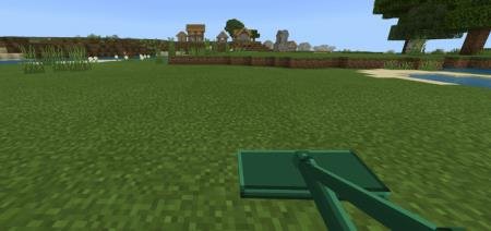 Косилку в руках у игрока