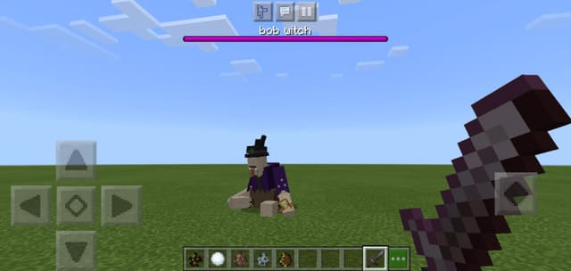 Боб-ведьма сидит на земле