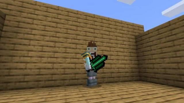 Зеленый Голиаф в руке игрока