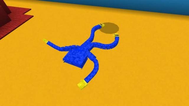 Хагги Вагги лежит на земле